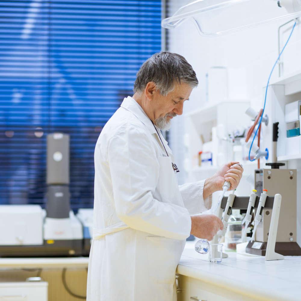 researcher working on hearing aids